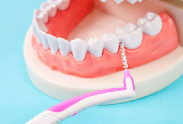 how to clean between teeth